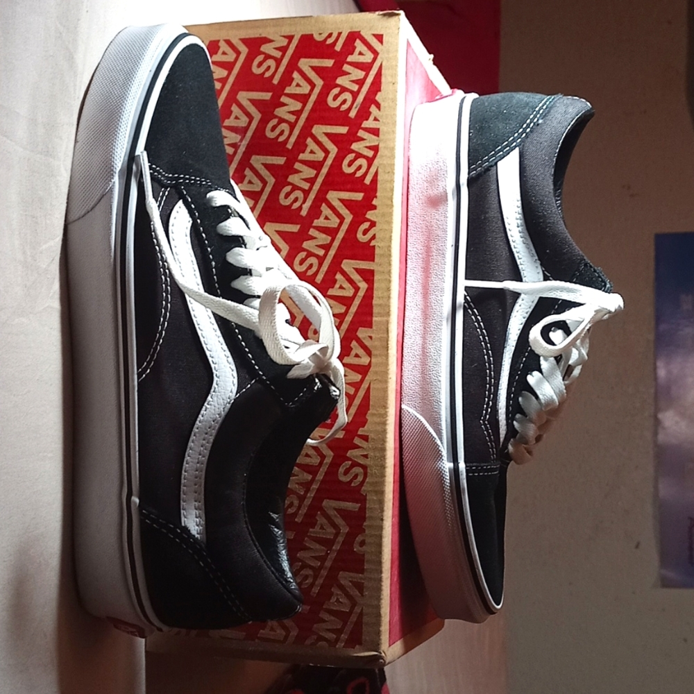 Size 7.5 black & white vans.
